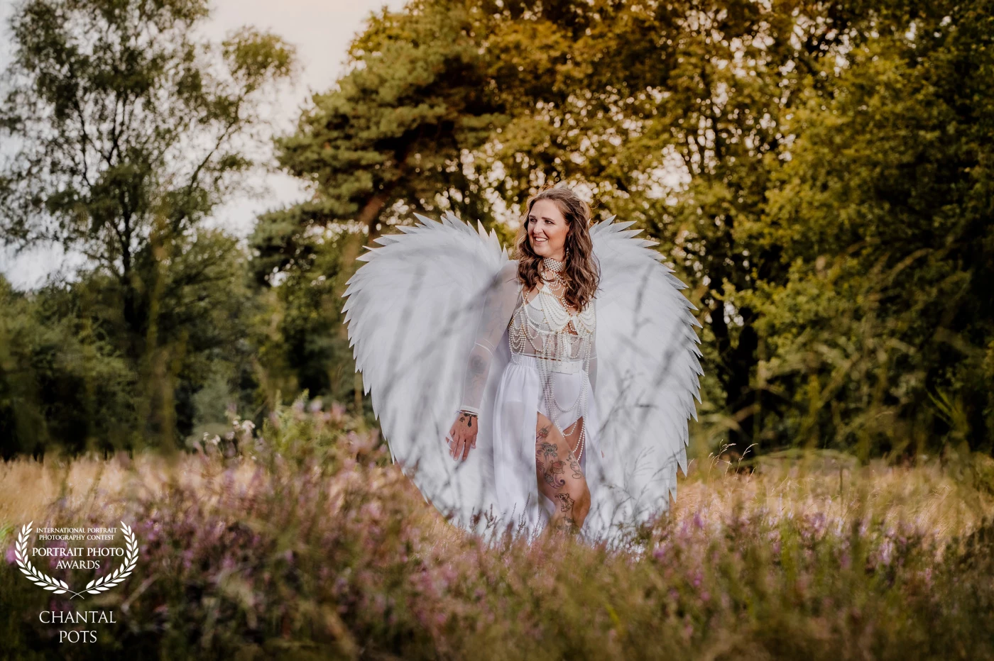 "A true powervrouw — fierce, free, and radiant, she walks through nature not just with wings, but with purpose. Her strength is soft, her beauty bold, her presence unforgettable."