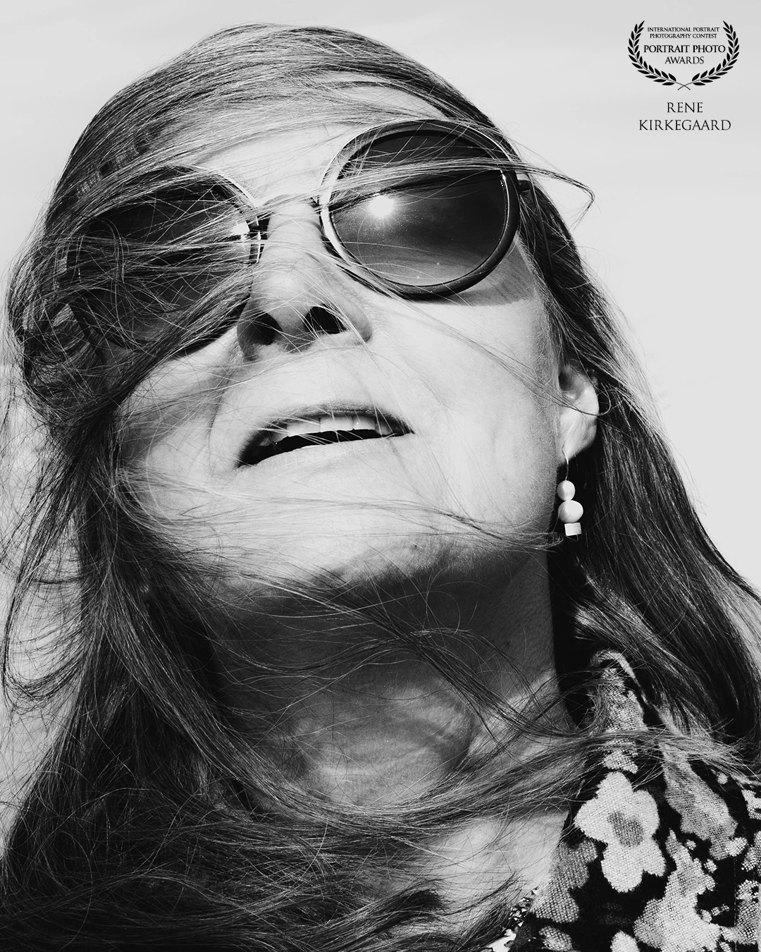 Long hair and shifting winds can create beautiful and dynamic portraits.<br />
This image was captured by the North Sea in Denmark, a place known for its harsh and windy weather. On this particular day, the wind was playful, while the sun served as the perfect source of light.