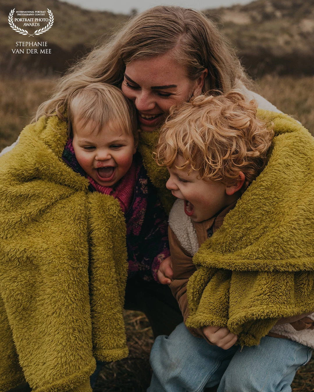 Wrapped in warmth and wild laughter,<br />
her love burst wide open—<br />
a mother’s heart too full to hold it all in.