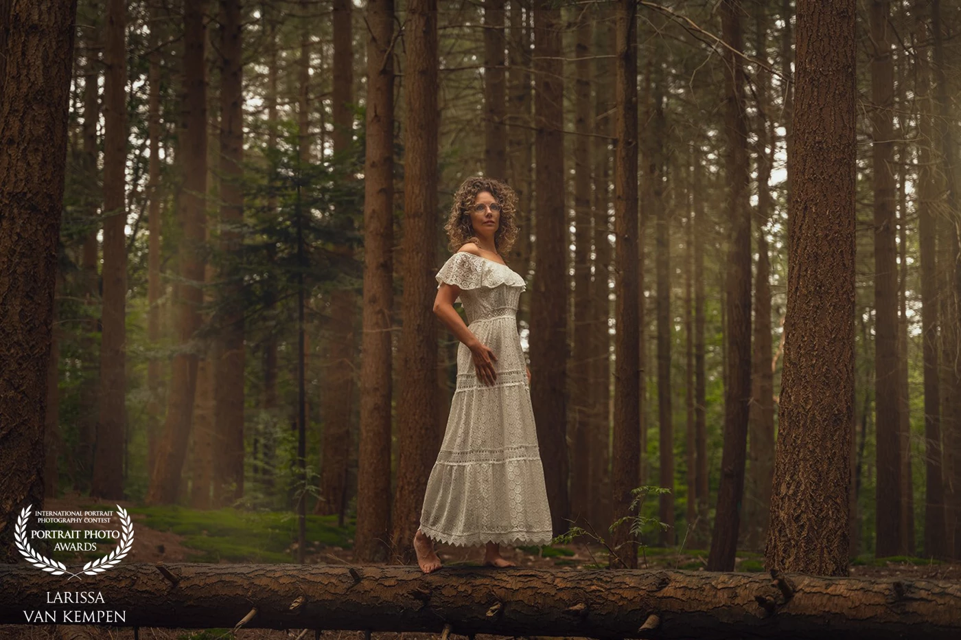 Barefoot in the forest —<br />
where silence breathes and strength whispers.<br />
She doesn’t conquer the world.<br />
She belongs to it.