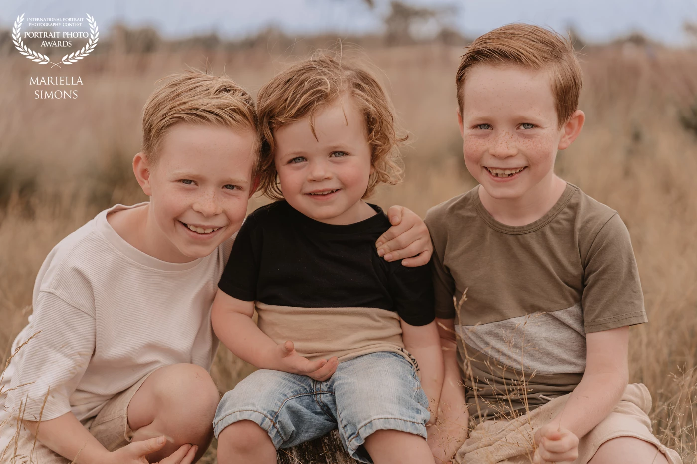 Three brothers. This heartfelt outdoor shoot reflects the warmth of sibling love and the beauty of childhood. A timeless image that celebrates family, nature, and togetherness.