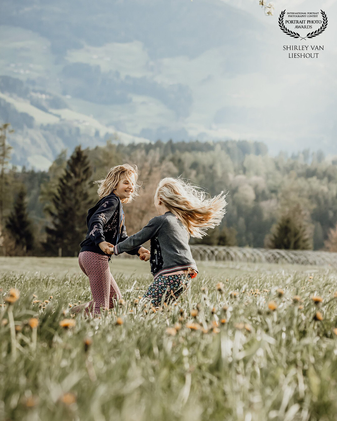 My 2 daughters playing together in the fields in Austria during our last holiday. This picture is so full of fun and laughter. I keep on smiling looking at this picture!