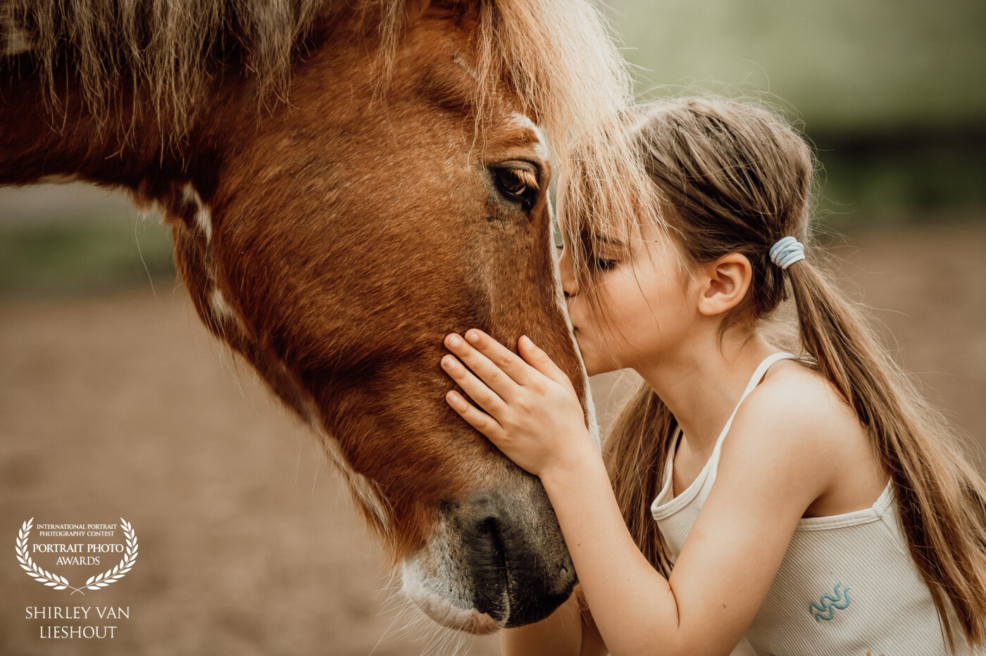 Having a photoshoot with your absolutely favorite pony of the riding school. That must be every horse girls' dream. This is Kit with her favorite pony Olaf. Such an intimate moment captured.