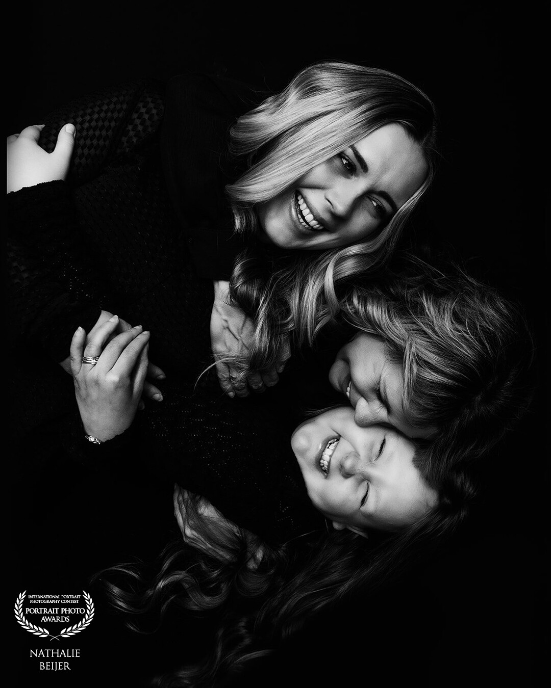 Nothing is more beautiful than the love between a mother and her daughters. This photo was taken during a Mother's Day photo shoot. The cosiness splashes off when you look at the photos. A valuable moment to cherish.
