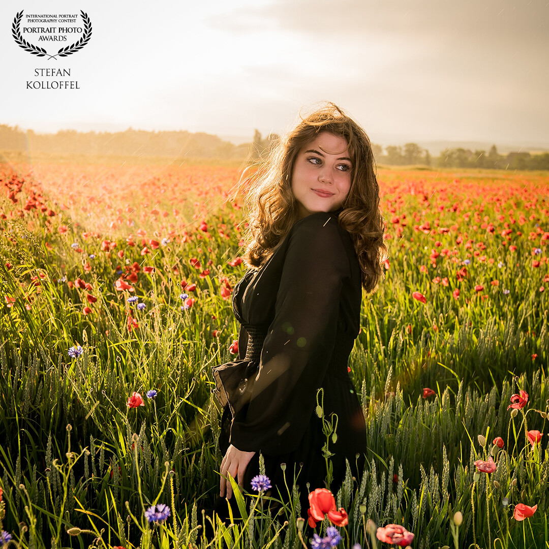 This shot is taken in a large poppy field with a rainy sky und a nice sunset!