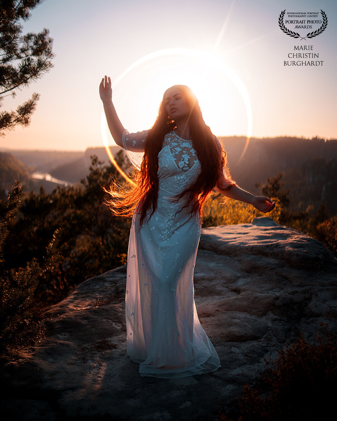 I took this photo a few months ago during a photo trip to Saxon Switzerland. We had a wonderful sunset at the Gamrig. When I was editing this photo I decided to add even more magic to it with the help of this halo behind Alina.<br />
<br />
Model: @alina_stolzenburg